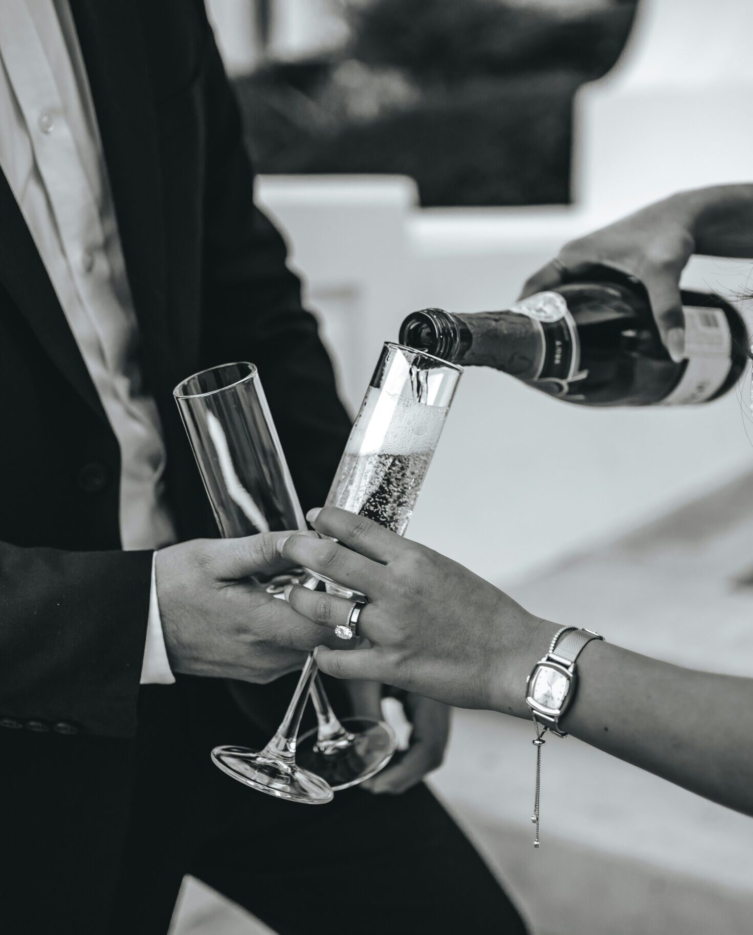 Champagne being poured into glass at Cotswolds wedding drinks reception